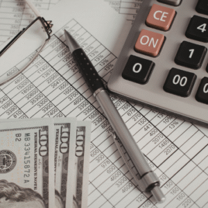 Two professional adults smiling, one holding a calculator, representing finance and accounting online learning.