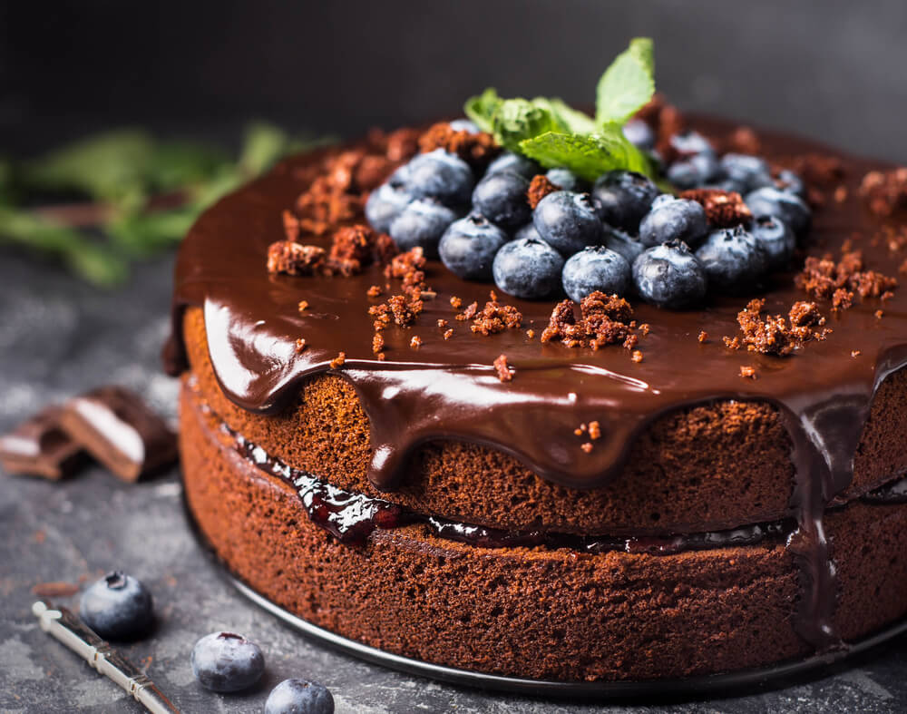 Chocolate cake with blueberry over the sink on the middle to cover it