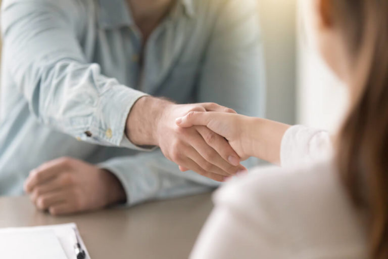 Recruitment consultant shaking hand with a candidate