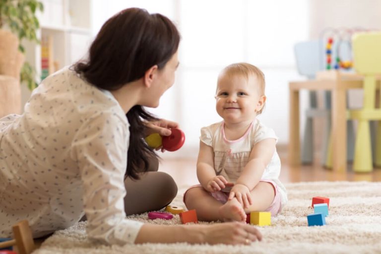 Cute baby with an adult female