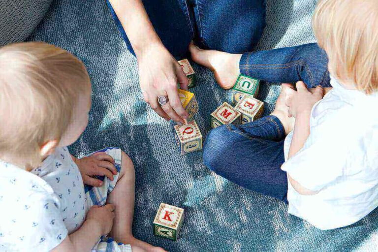 Students playing with their primary teacher