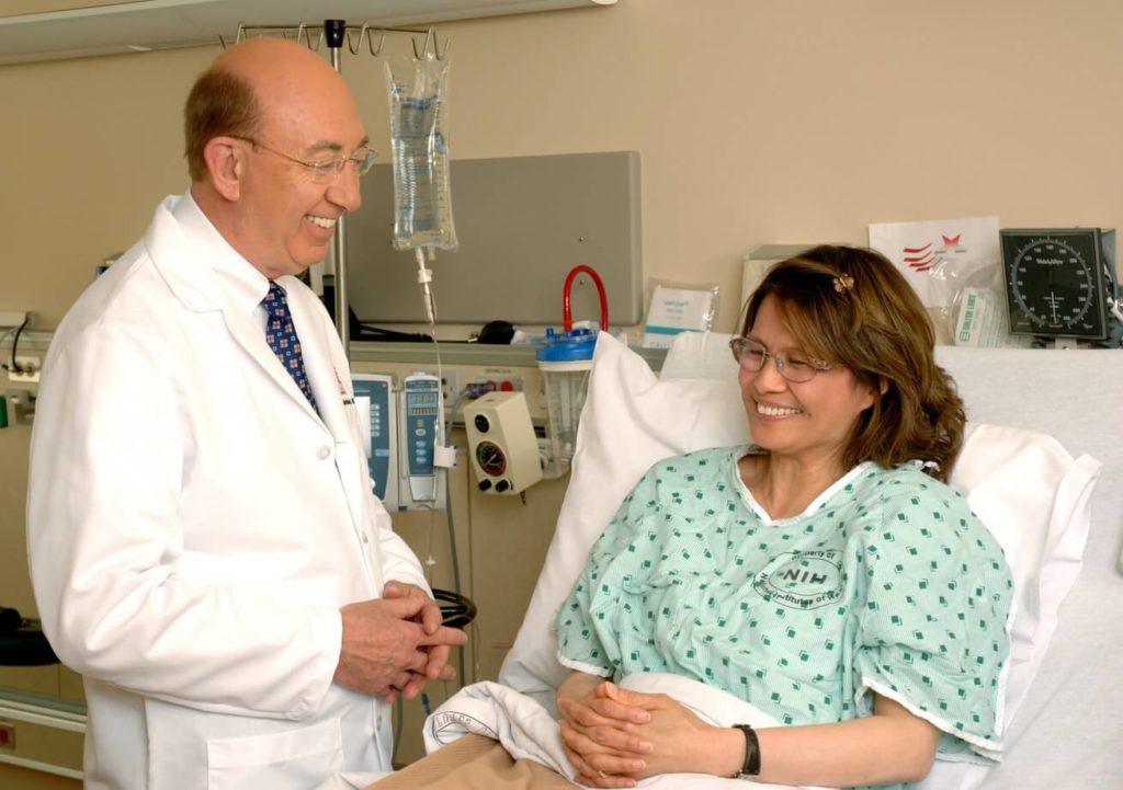 Doctor laughing with patient