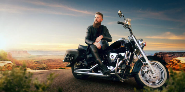 Bearded man sitting on a motorcycle