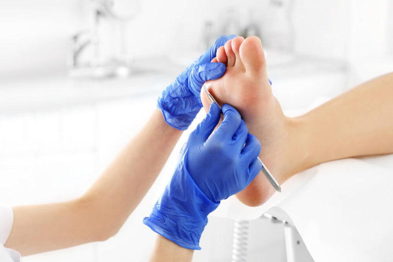 Chiropodist offering treatment
