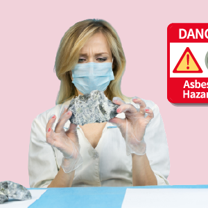 Woman holding a stone with a warning label about asbestos hazard and asbestos awareness training.