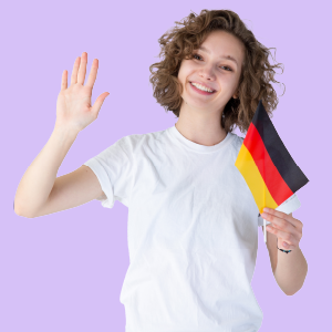 A cheerful girl with curly hair, wearing a white top, proudly holding a German flag.