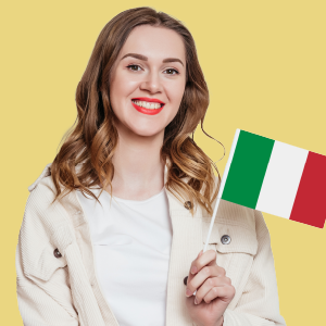 A beautiful girl with blonde hair holding an Italian flag in one hand and wearing a cream-colored top.