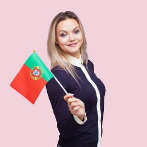 A Portuguese girl smiling while holding mini Portuguese flags in her hand.