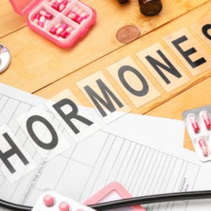 Hormonal therapy concept with pills, medical documents, and stethoscope