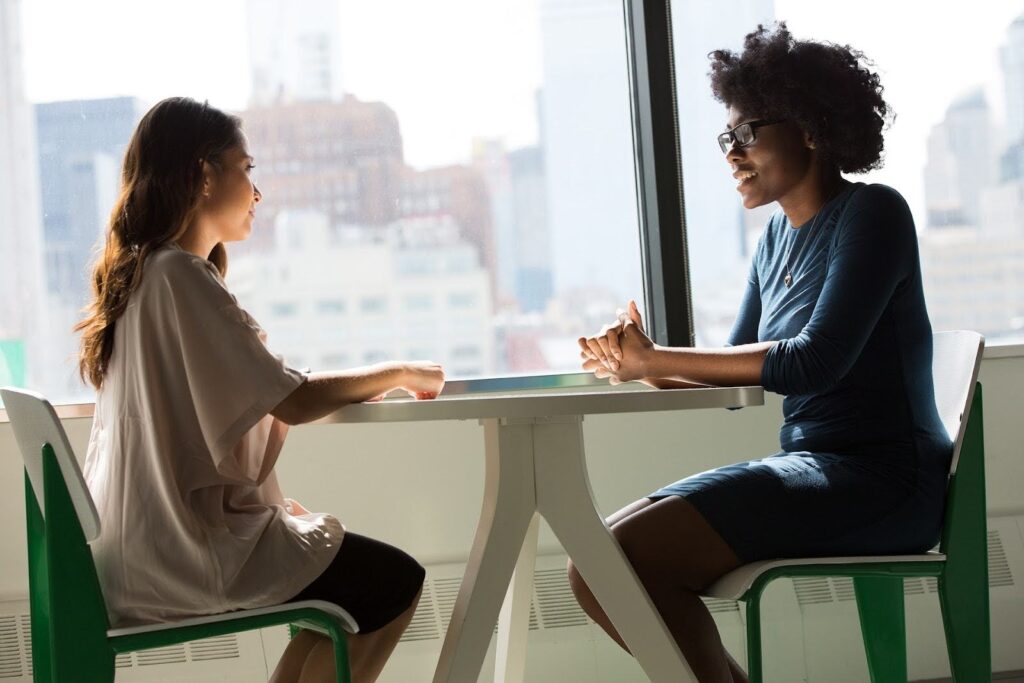 A manager in a regular check-in with their employee