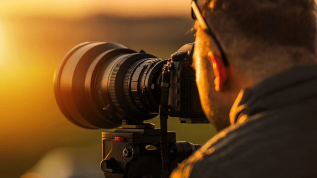 A person holding camera for Advanced Photography Course