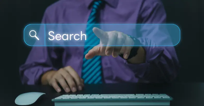 Person pointing at a virtual web search bar on screen, symbolizing digital exploration and online information retrieval
