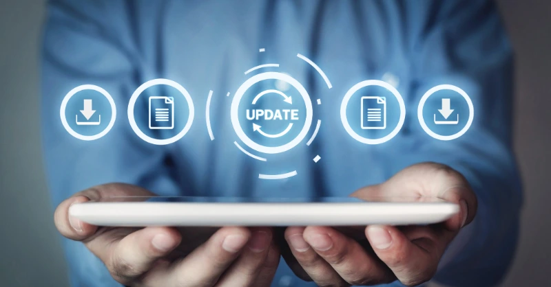 Using adaptability of new technology hands holding a tablet with floating icons for updates, downloads, and document sharing in a modern digital environment